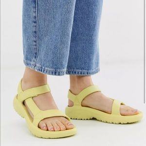 Yellow Teva hurricane drift sandals